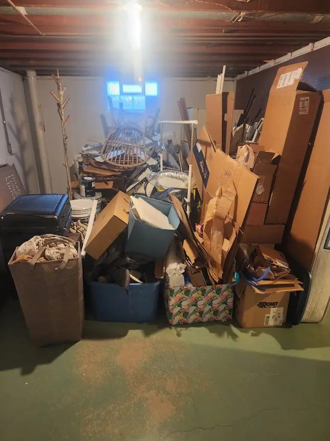 Roll-off dumpster container at job site for 2 Yard Dumpster Rental in Hunters Creek